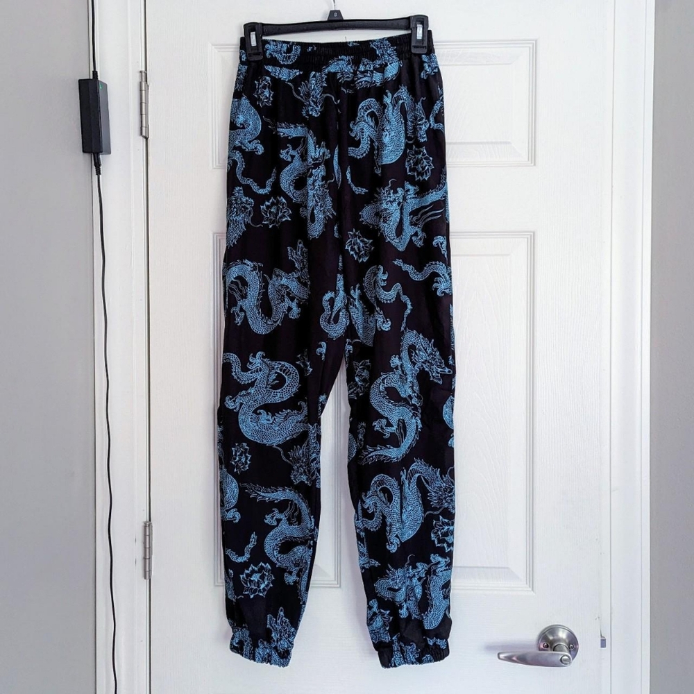 Black and teal dragon design joggers, size M